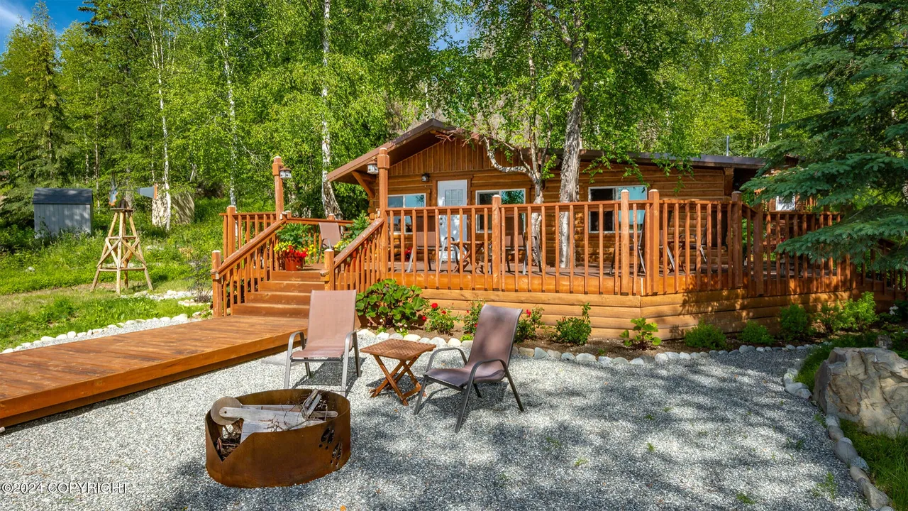 Guest cabin with stone landscaping and small water feature
