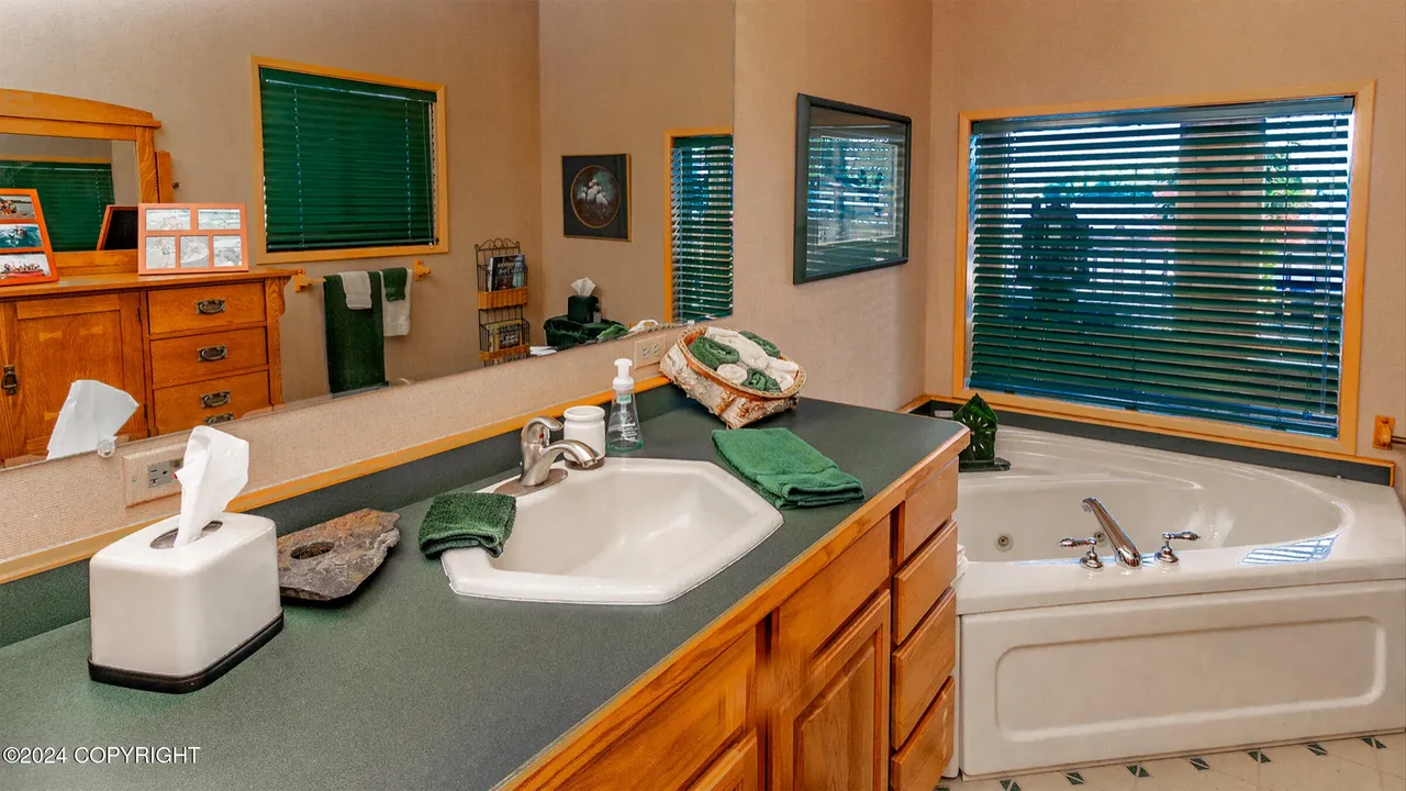 Main bathroom with jetted soaking tub and double sink